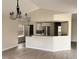 Kitchen with a granite counter, breakfast bar, stainless steel appliances, and a chandelier at 4414 Rice Mill Dr, North Charleston, SC 29420