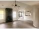 Open-concept living area with a fireplace, ceiling fan, and access to the kitchen at 4414 Rice Mill Dr, North Charleston, SC 29420