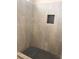 This bathroom features a walk-in shower with black and white tiled floor and a shower niche at 4414 Rice Mill Dr, North Charleston, SC 29420