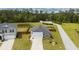 Aerial view of home with long driveway, fenced in yard, and pond in the back at 477 Spanish Wells Rd, Summerville, SC 29486