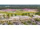 Aerial view of shopping center with Publix, retail stores, parking lot, and green space at 477 Spanish Wells Rd, Summerville, SC 29486