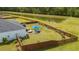 Aerial view of backyard with wooden fence, outdoor seating, and lush green space at 477 Spanish Wells Rd, Summerville, SC 29486