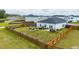 Aerial view of backyard with wooden fence, outdoor seating, and manicured green space at 477 Spanish Wells Rd, Summerville, SC 29486