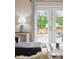An inside look at the serene backyard as seen through the living room French doors, showing a manicured outdoor space at 477 Spanish Wells Rd, Summerville, SC 29486
