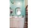 Bright bathroom featuring double sinks, contemporary lighting, and coastal-inspired decor for a fresh aesthetic at 477 Spanish Wells Rd, Summerville, SC 29486