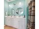 Charming bathroom equipped with double sinks, modern fixtures, and bright, inviting décor and ample counter space at 477 Spanish Wells Rd, Summerville, SC 29486