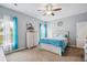 Bright bedroom offers a cozy ambiance with soft carpet, a ceiling fan, and a light color palette at 477 Spanish Wells Rd, Summerville, SC 29486