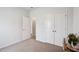Bedroom features neutral walls, double closet, and neutral carpet at 477 Spanish Wells Rd, Summerville, SC 29486