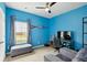 Blue bedroom featuring a ceiling fan, window with curtains, and neutral carpet at 477 Spanish Wells Rd, Summerville, SC 29486