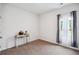 Neutral bedroom with a table, window with curtains and neutral carpet at 477 Spanish Wells Rd, Summerville, SC 29486