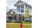 View of the front of the Cane Bay Gathering YMCA, featuring a welcoming entrance, bike racks, and well-maintained landscaping at 477 Spanish Wells Rd, Summerville, SC 29486