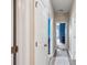 Hallway featuring hardwood floors, white doors, and neutral wall color at 477 Spanish Wells Rd, Summerville, SC 29486