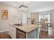 Kitchen island featuring stainless dishwasher, granite countertops, and open sightlines to the dining area at 477 Spanish Wells Rd, Summerville, SC 29486