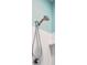 Modern bathroom shower head with white tile and light blue accent wall at 477 Spanish Wells Rd, Summerville, SC 29486