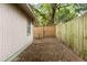 Exterior shot of a backyard featuring wood fence and some natural landscaping at 5037 Alpha St, North Charleston, SC 29405
