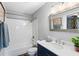 Stylish bathroom features a shower-over-tub combination, modern vanity, and decorative accents at 5037 Alpha St, North Charleston, SC 29405
