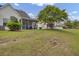 Backyard featuring well-manicured lawn and home exteriors with screened porches at 5223 Fernland Way, Charleston, SC 29420