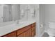 Bathroom showcasing a vanity with wood cabinets, a large mirror, and a separate shower area at 5223 Fernland Way, Charleston, SC 29420