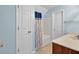 A bathroom features white walls, a tub/shower combo, and a vanity at 5223 Fernland Way, Charleston, SC 29420