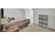 Bedroom features a bed with patterned comforter, side table, and soft carpeting at 5223 Fernland Way, Charleston, SC 29420