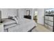 Bedroom with muted tones, natural light, and view of the ensuite living area at 5223 Fernland Way, Charleston, SC 29420