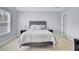 Comfortable bedroom with soft, neutral tones, a queen-size bed, and natural light from the window at 5223 Fernland Way, Charleston, SC 29420