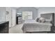 Bedroom featuring neutral tones, a ceiling fan, wall-mounted television, and ample closet space at 5223 Fernland Way, Charleston, SC 29420