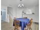 Open layout with dining area, staircase, arch window, and blue tablecloth at 5223 Fernland Way, Charleston, SC 29420