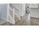 Hallway with new laminate flooring and white trim at 5223 Fernland Way, Charleston, SC 29420