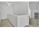 Upstairs hallway with soft neutral carpet, white walls, and white trim at 5223 Fernland Way, Charleston, SC 29420
