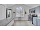 Modern kitchen featuring stainless steel appliances, granite counters, and lots of natural light from a large window at 5223 Fernland Way, Charleston, SC 29420