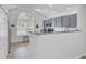 Modern kitchen featuring stainless steel appliances, granite counters, and lots of natural light from a large window at 5223 Fernland Way, Charleston, SC 29420