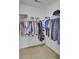 Efficiently organized walk-in closet, maximizing storage space with rods, shelves, and shoe racks at 5223 Fernland Way, Charleston, SC 29420