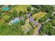 Stunning aerial view of community pool, tennis courts, and green spaces surrounded by lush trees at 543 Castle Hall Rd, Mount Pleasant, SC 29464