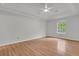 Large bedroom with wood floors, neutral paint, trey ceiling, and a window at 543 Castle Hall Rd, Mount Pleasant, SC 29464