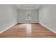 Spacious bedroom with wood floors, neutral paint, and a large window at 543 Castle Hall Rd, Mount Pleasant, SC 29464