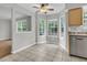 Bright breakfast nook with large windows, neutral paint, ceiling fan, and tile flooring at 543 Castle Hall Rd, Mount Pleasant, SC 29464