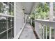 Charming front porch with white railing, brick trim, and decorative lighting at 543 Castle Hall Rd, Mount Pleasant, SC 29464