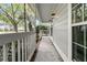 Inviting front porch with white railing and view of surrounding neighborhood at 543 Castle Hall Rd, Mount Pleasant, SC 29464
