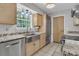 Modern kitchen with stainless steel appliances, granite countertops, and a stainless steel sink at 543 Castle Hall Rd, Mount Pleasant, SC 29464