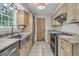 Modern kitchen with stainless steel appliances, granite countertops, and a large stainless steel sink at 543 Castle Hall Rd, Mount Pleasant, SC 29464