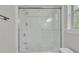 Modern shower and tub encased in glass featuring white tiled walls at 543 Castle Hall Rd, Mount Pleasant, SC 29464