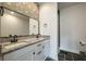 Well-appointed bathroom featuring dual sinks, granite countertops, and a stylish tile shower at 5514 Colonial Chatsworth Cir, North Charleston, SC 29418