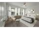 Bright bedroom with a ceiling fan, carpet, and sun-filled windows at 5514 Colonial Chatsworth Cir, North Charleston, SC 29418
