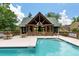 Community pool with an open-air clubhouse offering a beautiful space for residents to relax and socialize at 5514 Colonial Chatsworth Cir, North Charleston, SC 29418