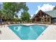 Inviting community pool with lounge chairs and tables, offering a perfect spot to relax and soak up the sun at 5514 Colonial Chatsworth Cir, North Charleston, SC 29418