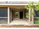 Covered screened porch with neutral tones offering a comfortable outdoor space at 5514 Colonial Chatsworth Cir, North Charleston, SC 29418