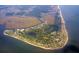 Expansive aerial view of an island featuring beautiful homes, marshlands, and ocean views at 60 Rice Ln, Edisto Beach, SC 29438