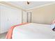 Bright bedroom featuring neutral walls, double closets, and a comfortable bed, creating a cozy and inviting space at 60 Rice Ln, Edisto Beach, SC 29438