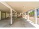 Spacious carport underneath elevated home with support beams and concrete flooring at 60 Rice Ln, Edisto Beach, SC 29438